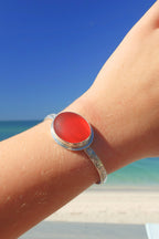 Amberina sea glass cuff bracelet – sterling silver adjustable jewelry with glowing red-orange glass from Spain