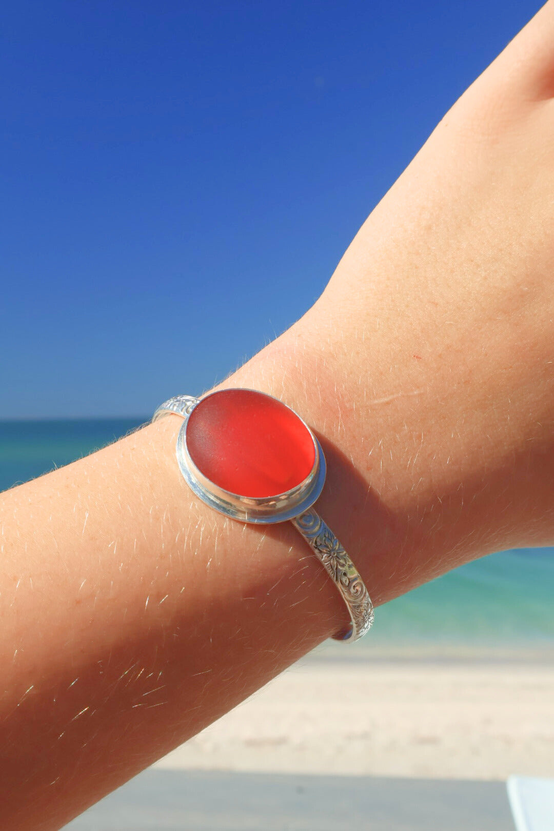 Amberina sea glass cuff bracelet – sterling silver adjustable jewelry with glowing red-orange glass from Spain