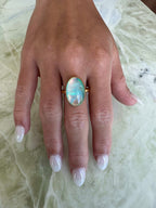 Gold vermeil ring featuring iridescent Aurora opal with shifting hues of blue, pink, and green, set in sterling silver base with thick gold plating
