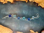 Exceptional blue sea glass multi-bezel bracelet – sterling silver handcrafted ocean jewelry from Russia