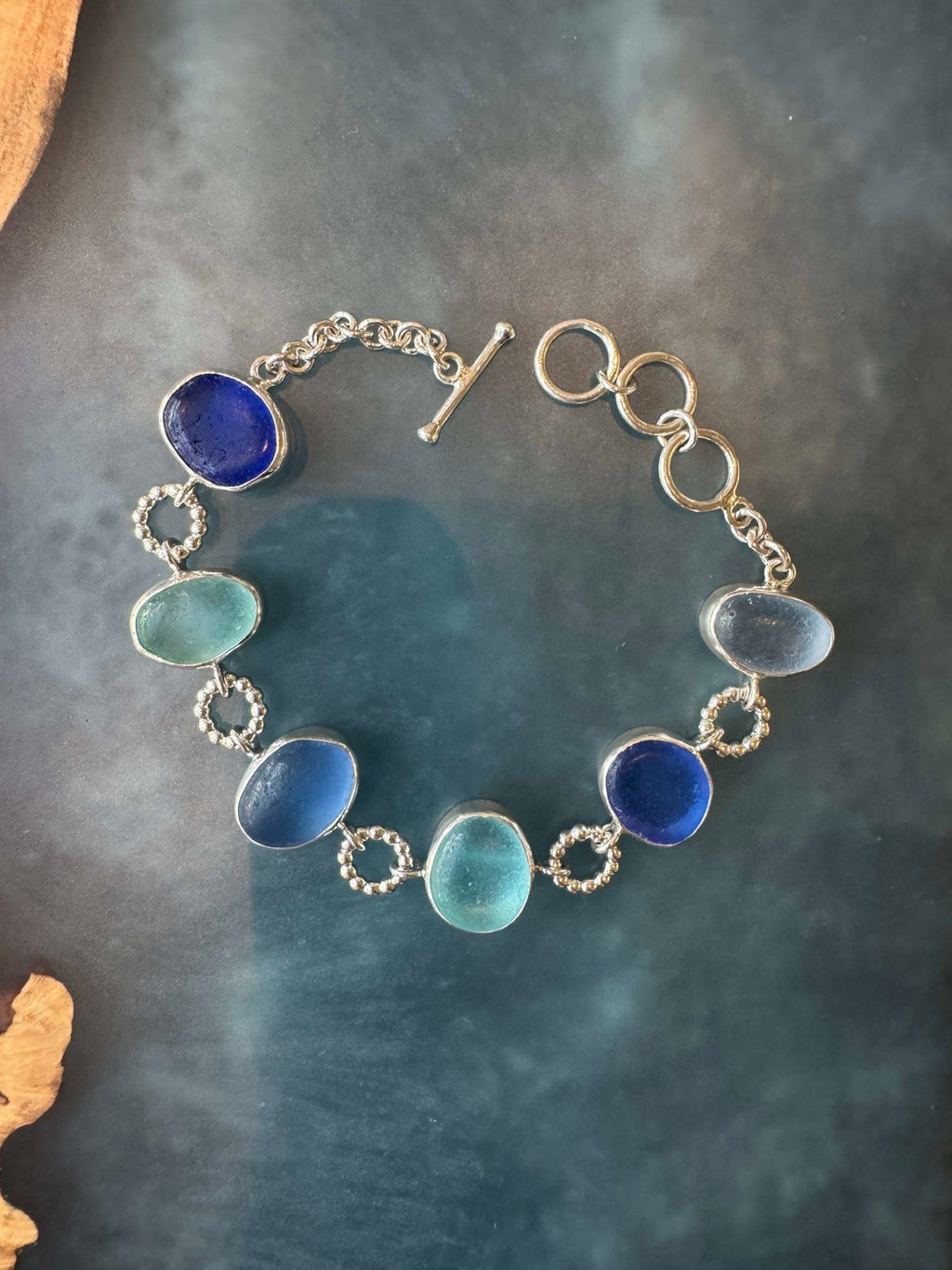 Exceptional blue sea glass multi-bezel bracelet – sterling silver handcrafted ocean jewelry from Russia