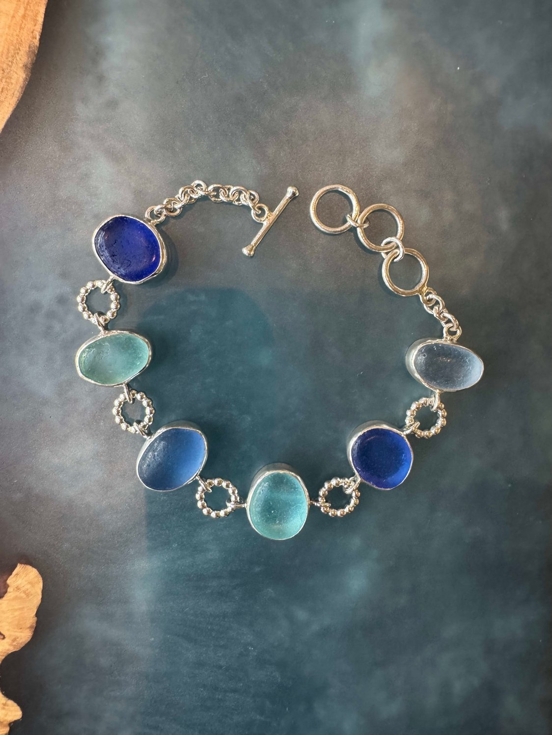 Exceptional blue sea glass multi-bezel bracelet – sterling silver handcrafted ocean jewelry from Russia