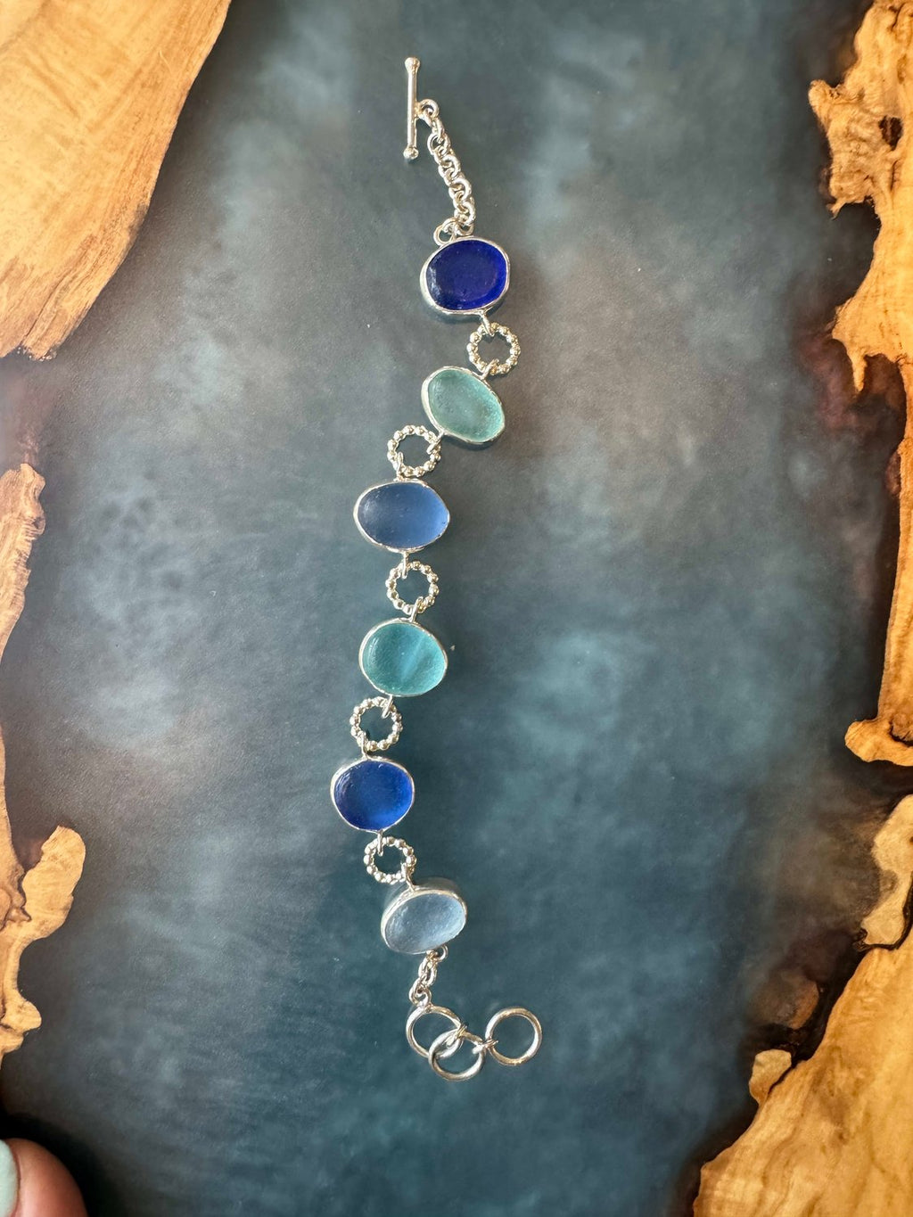 Exceptional blue sea glass multi-bezel bracelet – sterling silver handcrafted ocean jewelry from Russia