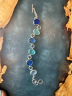 Exceptional blue sea glass multi-bezel bracelet – sterling silver handcrafted ocean jewelry from Russia