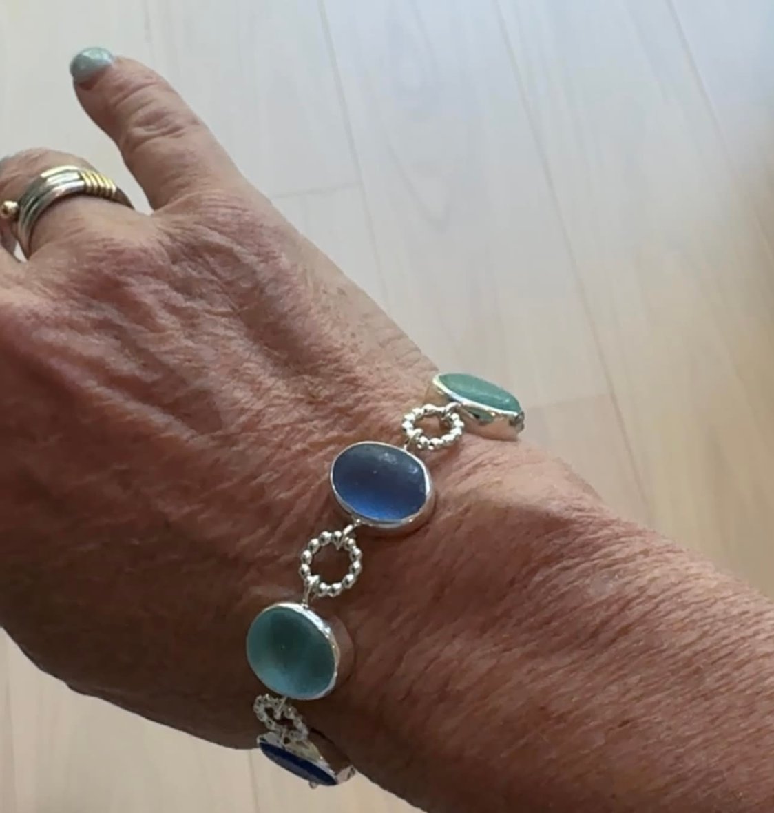 Exceptional blue sea glass multi-bezel bracelet – sterling silver handcrafted ocean jewelry from Russia