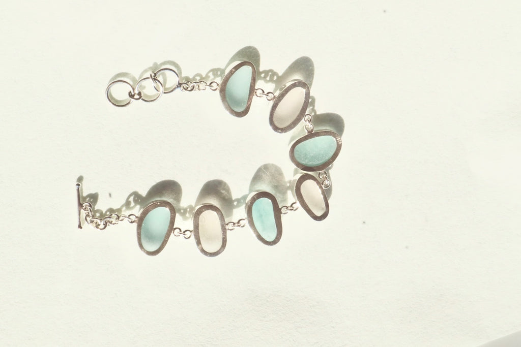 Blue and white Italian sea glass bracelet set in sterling silver with adjustable toggle closure