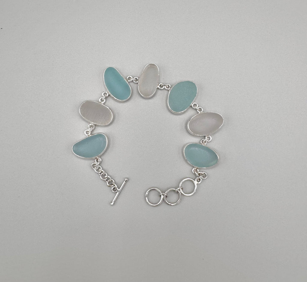 Blue and white Italian sea glass bracelet set in sterling silver with adjustable toggle closure