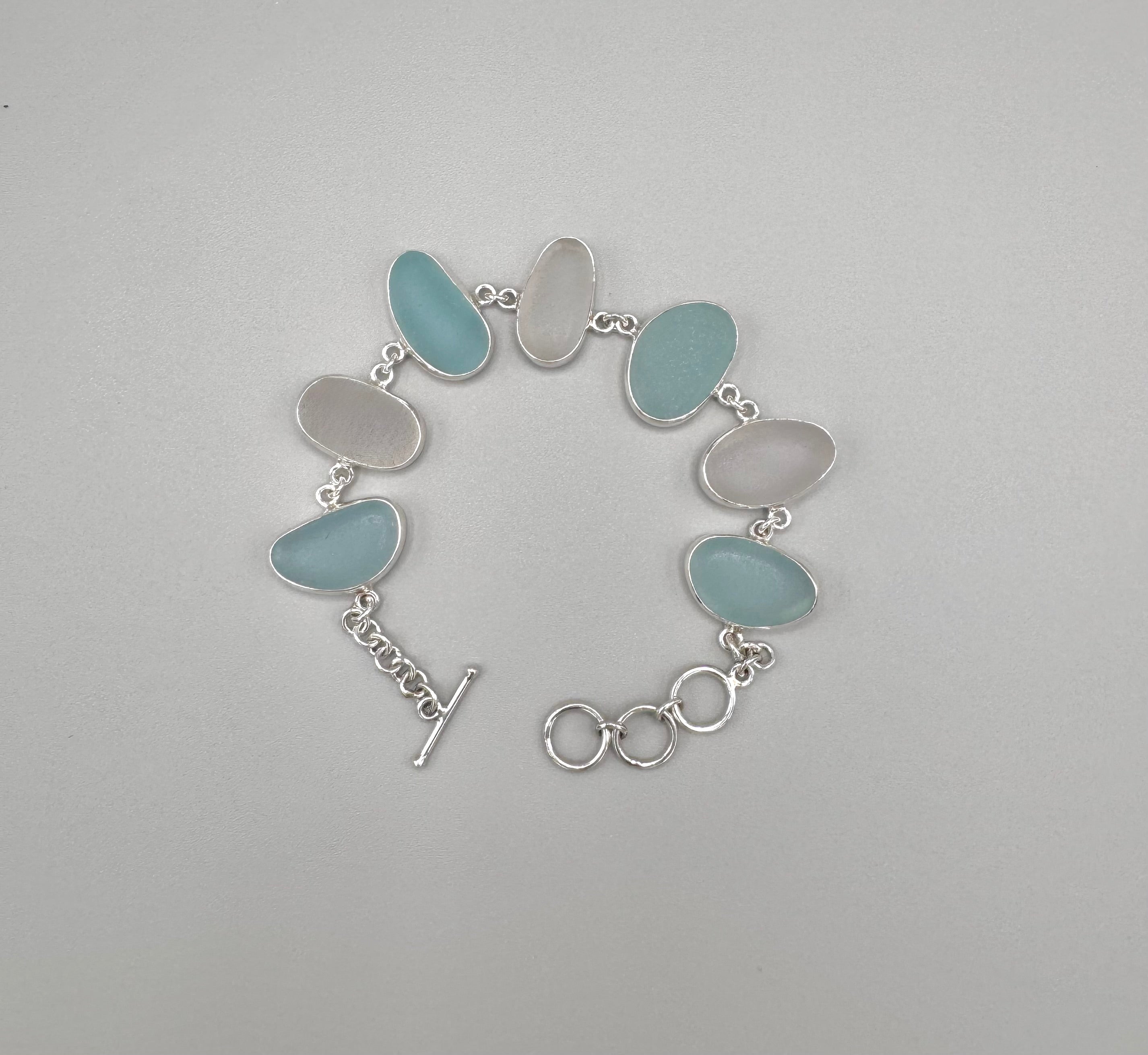 Blue and white Italian sea glass bracelet set in sterling silver with adjustable toggle closure