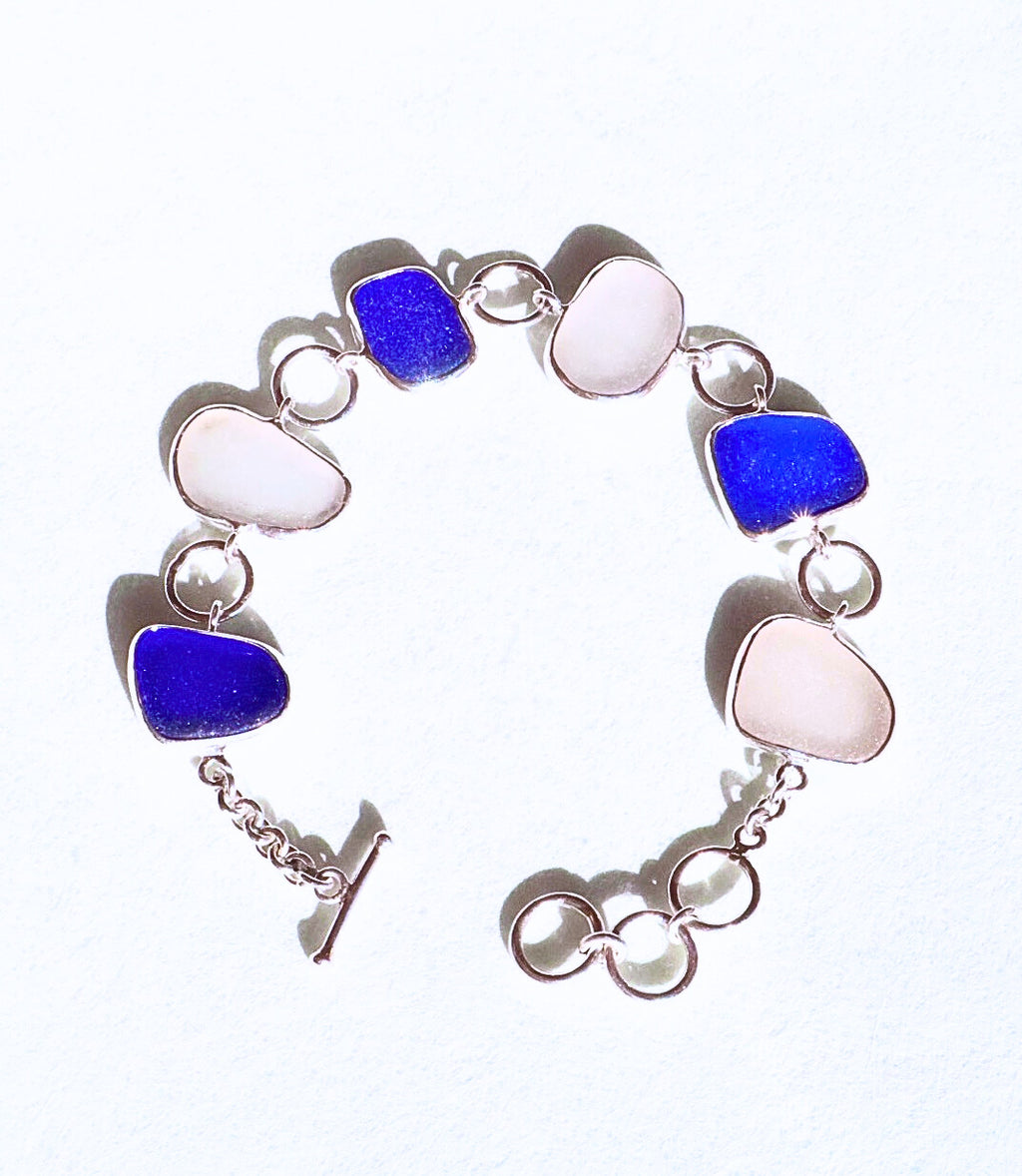 Cobalt blue and white sea glass bracelet set in sterling silver, handcrafted with sea glass from Spain’s Mediterranean coast.