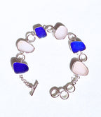 Cobalt blue and white sea glass bracelet set in sterling silver, handcrafted with sea glass from Spain’s Mediterranean coast.