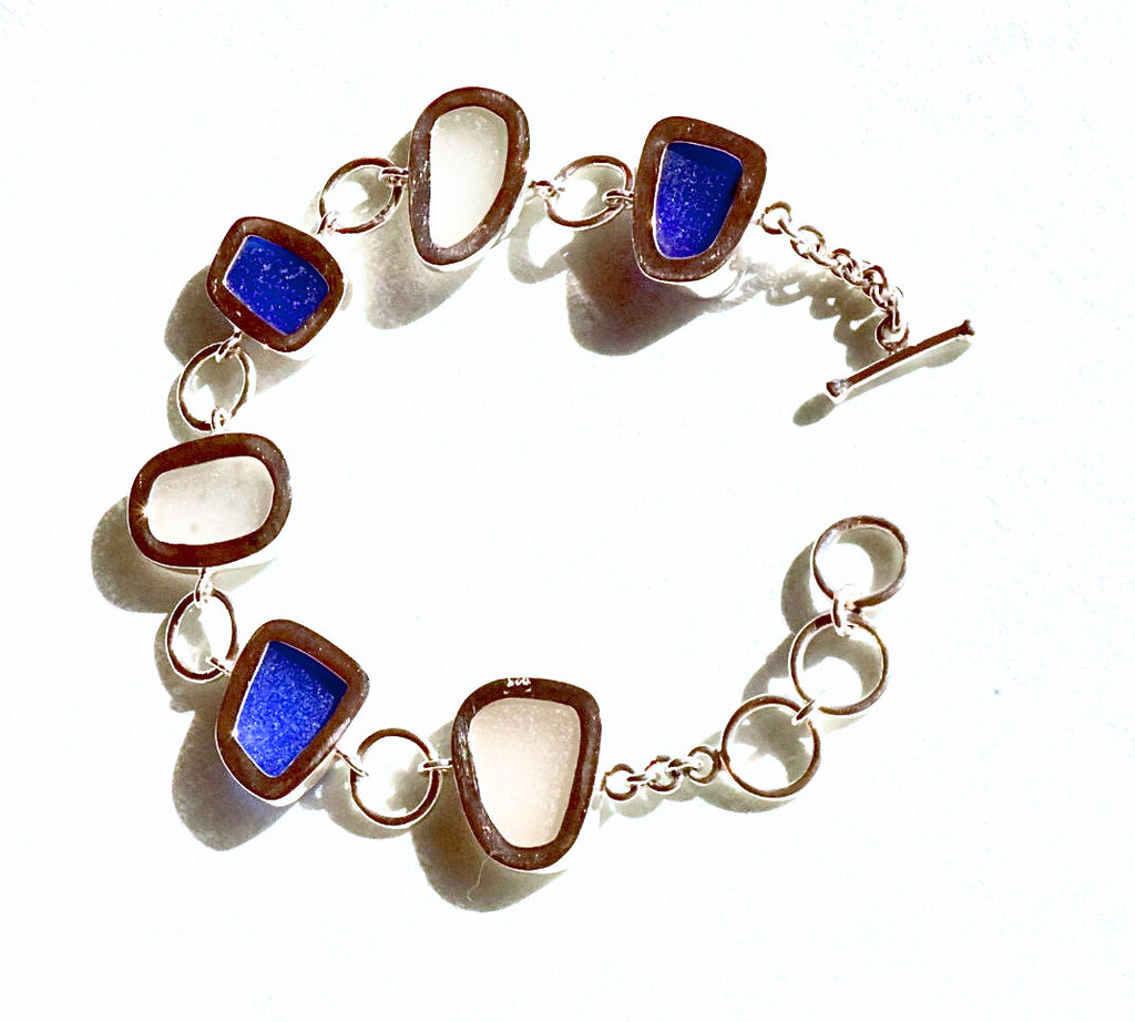 Cobalt blue and white sea glass bracelet set in sterling silver, handcrafted with sea glass from Spain’s Mediterranean coast.