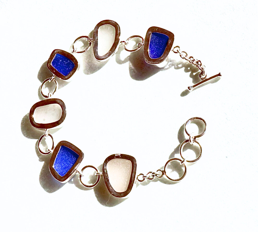Cobalt blue and white sea glass bracelet set in sterling silver, handcrafted with sea glass from Spain’s Mediterranean coast.