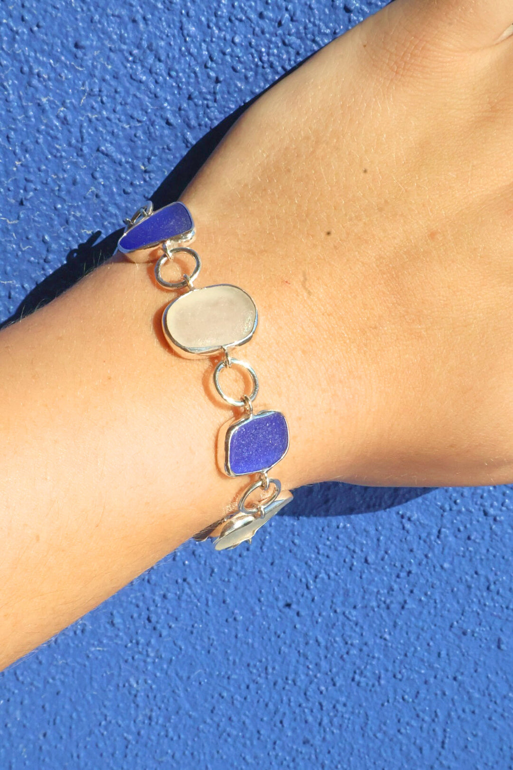 Cobalt blue and white sea glass bracelet set in sterling silver, handcrafted with sea glass from Spain’s Mediterranean coast.