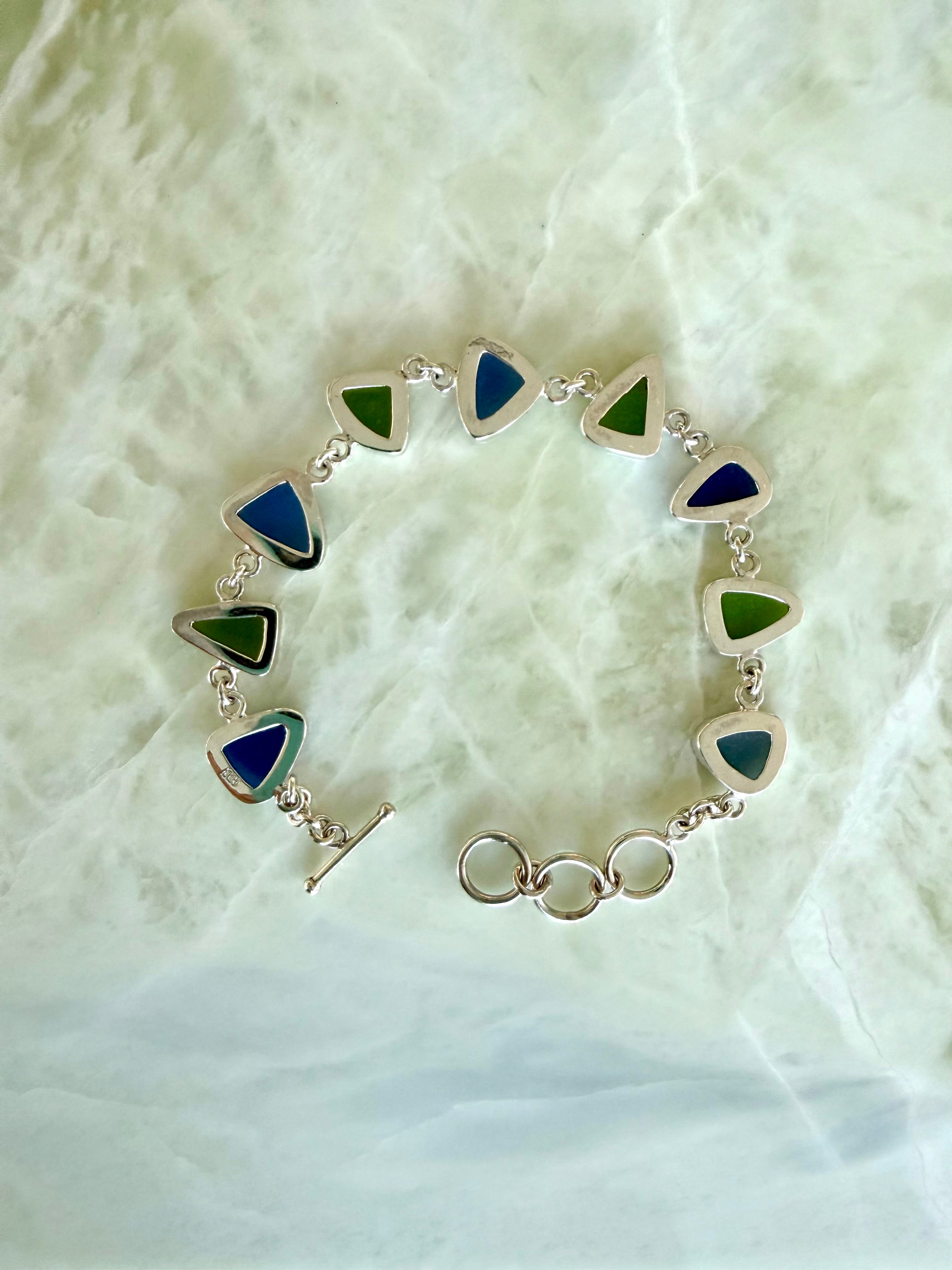 Sterling silver bracelet featuring cobalt blue and lime green sea glass from the Jersey Shore.