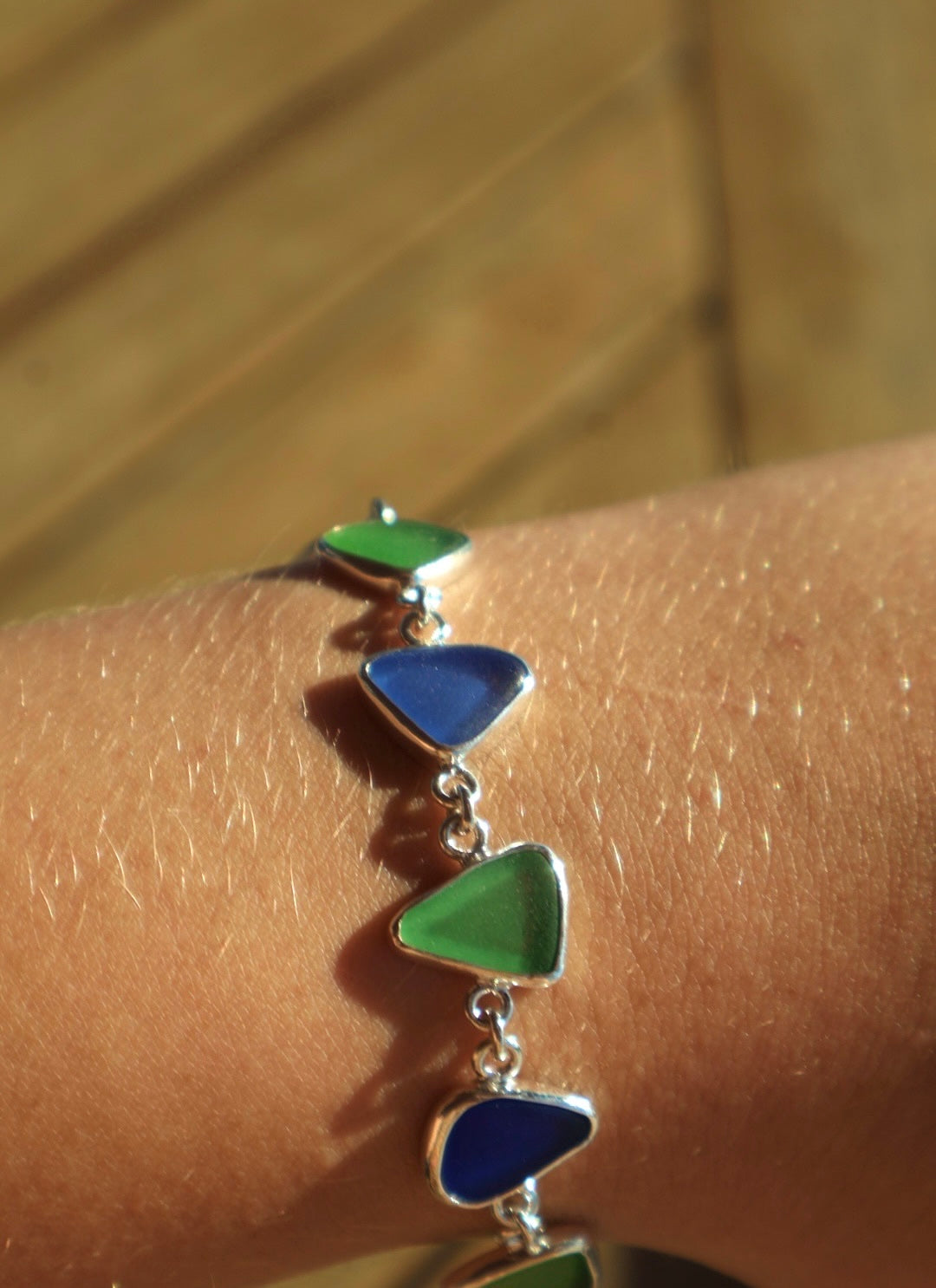 Sterling silver bracelet featuring cobalt blue and lime green sea glass from the Jersey Shore.