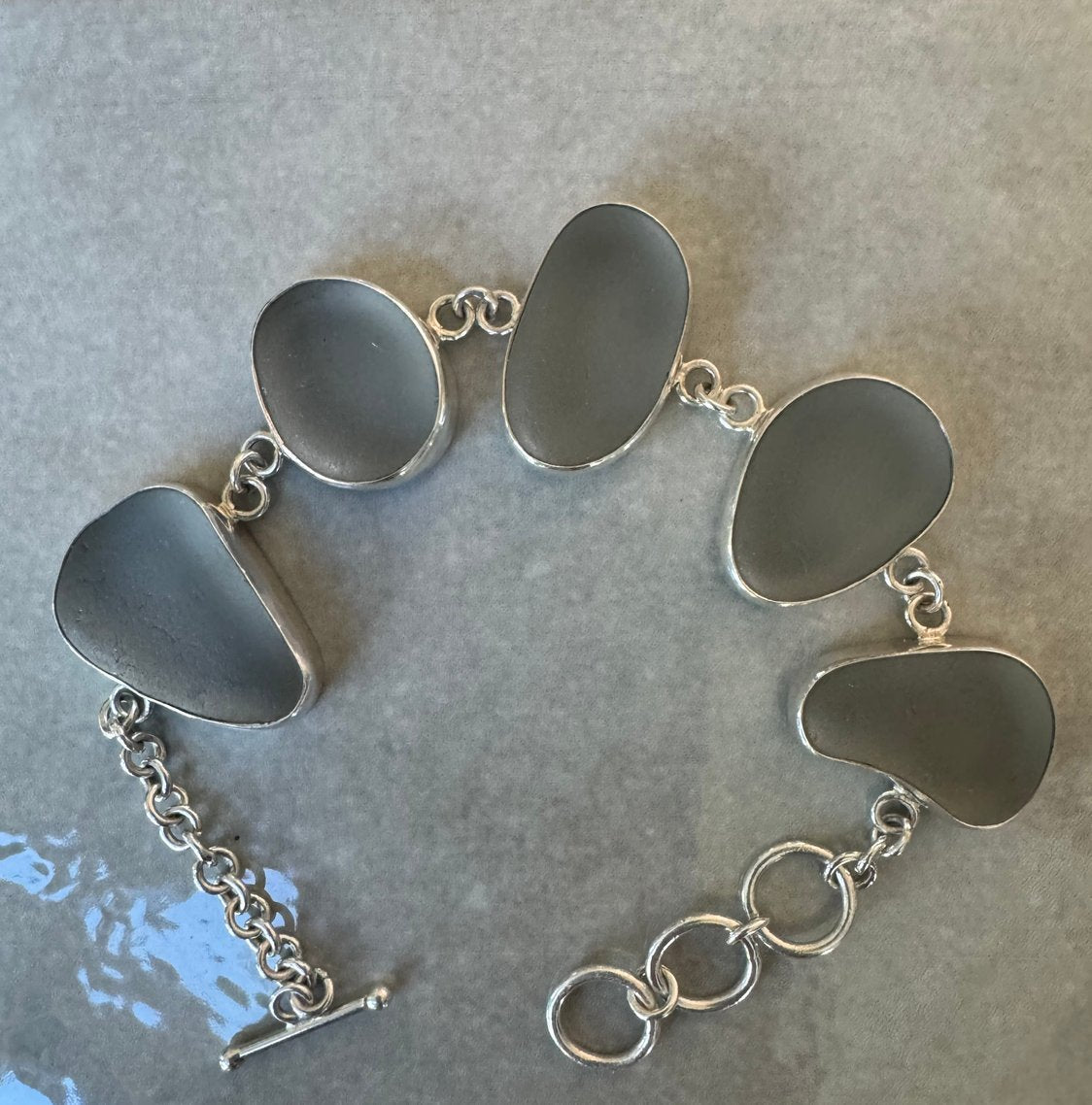 Gray Italian sea glass bracelet – sterling silver adjustable cuff, handcrafted ocean jewelry