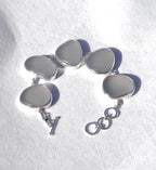 Sterling silver bracelet featuring five thick, frosted gray-lavender Sicilian sea glass pieces with adjustable clasp.