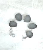 Sterling silver bracelet featuring five thick, frosted gray-lavender Sicilian sea glass pieces with adjustable clasp.