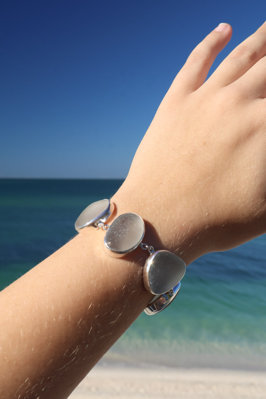 Sterling silver bracelet featuring five thick, frosted gray-lavender Sicilian sea glass pieces with adjustable clasp.