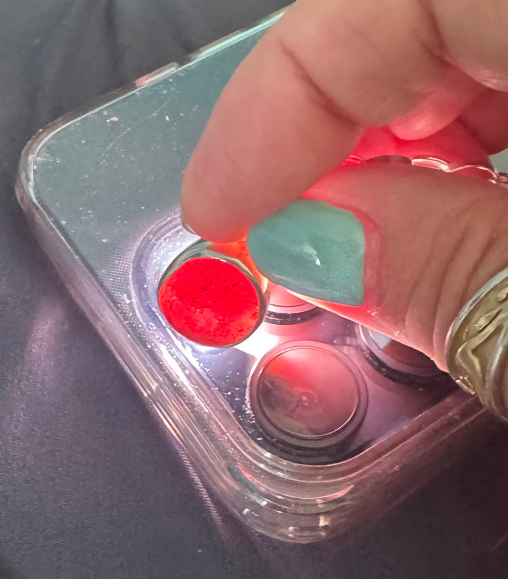 Historic charm bracelet featuring Sicilian red-glow black sea glass, fossilized shark tooth, and amber sea glass from England, set in sterling silver.