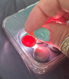 Historic charm bracelet featuring Sicilian red-glow black sea glass, fossilized shark tooth, and amber sea glass from England, set in sterling silver.