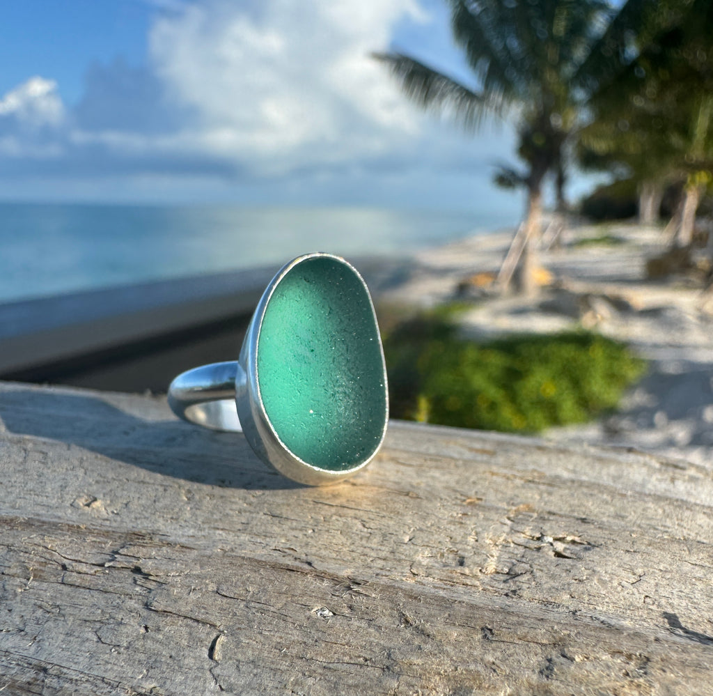Sterling silver ring featuring smooth aquamarine Japanese sea glass from hand-blown fishing net floats.