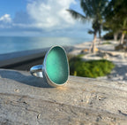 Sterling silver ring featuring smooth aquamarine Japanese sea glass from hand-blown fishing net floats.