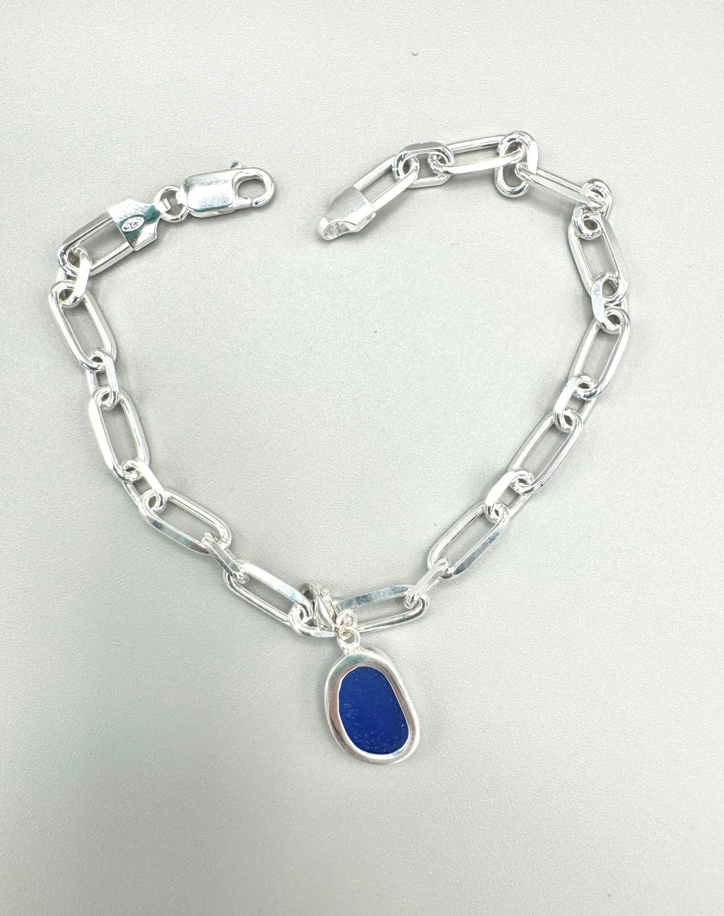 Sterling silver paperclip anklet with deep Mediterranean blue sea glass charm from Spain.