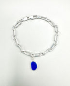 Sterling silver paperclip anklet with deep Mediterranean blue sea glass charm from Spain.