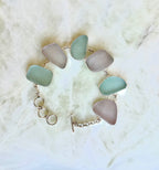 Sterling silver bracelet featuring pale blue and lavender sea glass from Glass Beach, Fort Bragg, California.