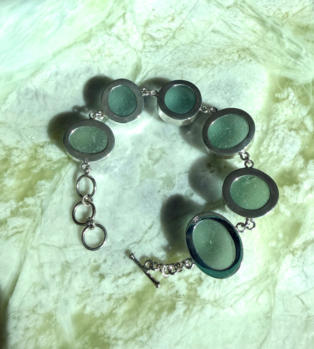 Sterling silver adjustable bracelet featuring antique seafoam green sea glass from the North Sea coast of England.