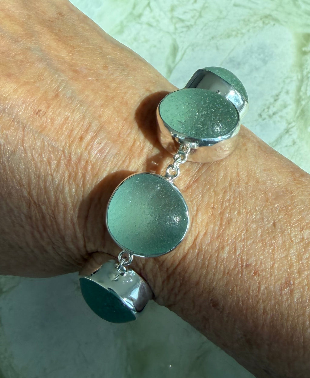 Sterling silver adjustable bracelet featuring antique seafoam green sea glass from the North Sea coast of England.